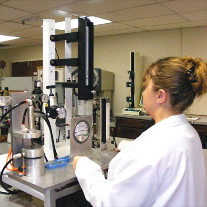 Woman working in the M.A. Indutries Laboratory